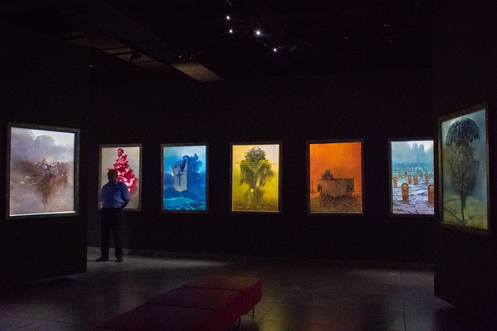 <img src="paintings.png" alt="Zadislaw Beksinski's paintings in a gallery">