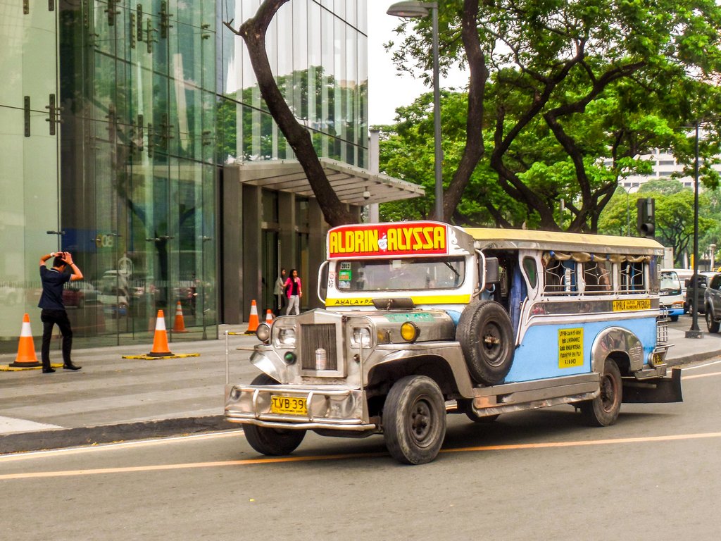 <img src="jeepney bus.gif" alt="jeepney bus on a road in Manila city">